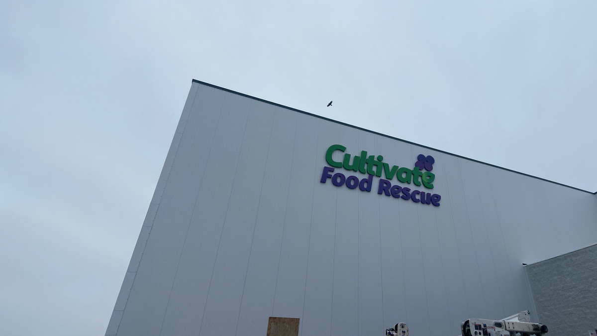 Building with 'Cultivate Food Rescue' logo on a cloudy day