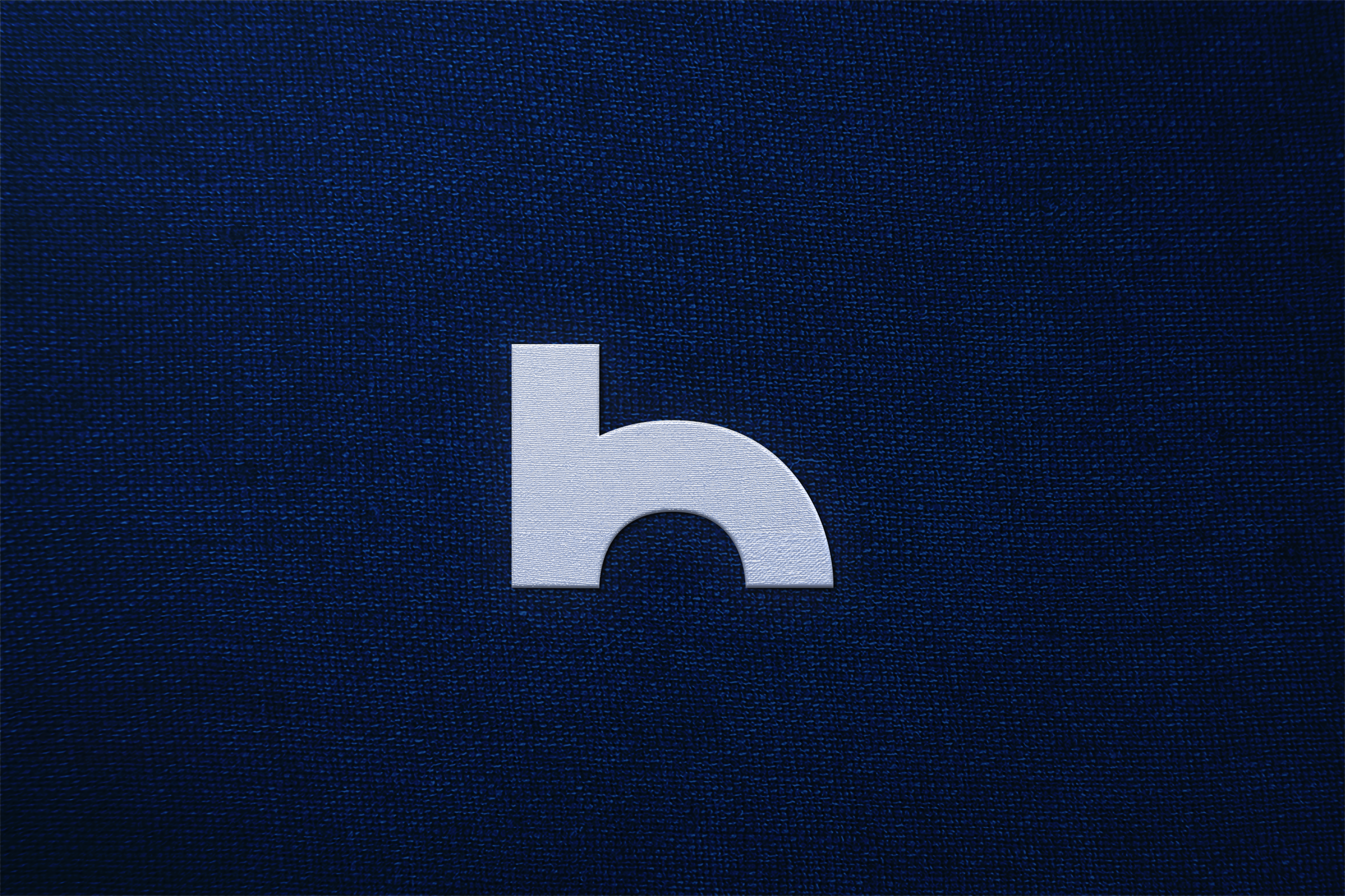 White logo on a dark blue textured background
