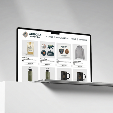 Computer screen displaying Aurora Roast Co. merchandise and product options on a white background